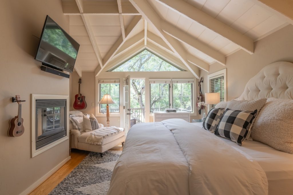 The Treehouse Suite, a private king suite with a balcony in the trees